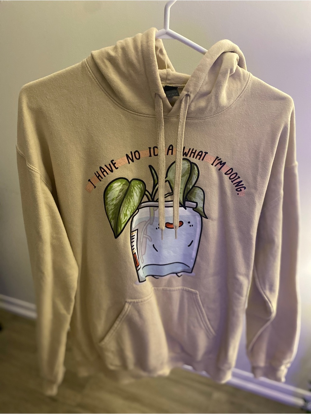 Gildan cream hoodie with illustrated potted plant and phrase